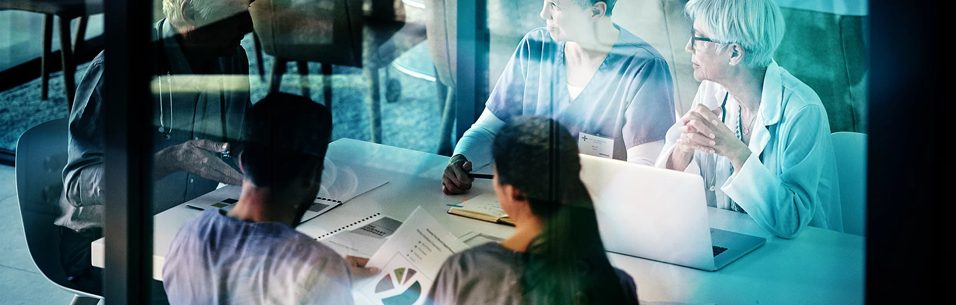 Shot of a group of medical professionals having a meeting together inside a boardroom at a hospital