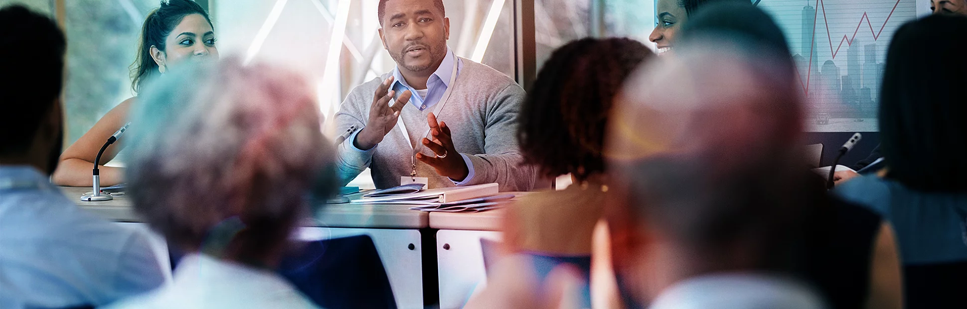 During the business expo a man answers a question with confidence and assurance.