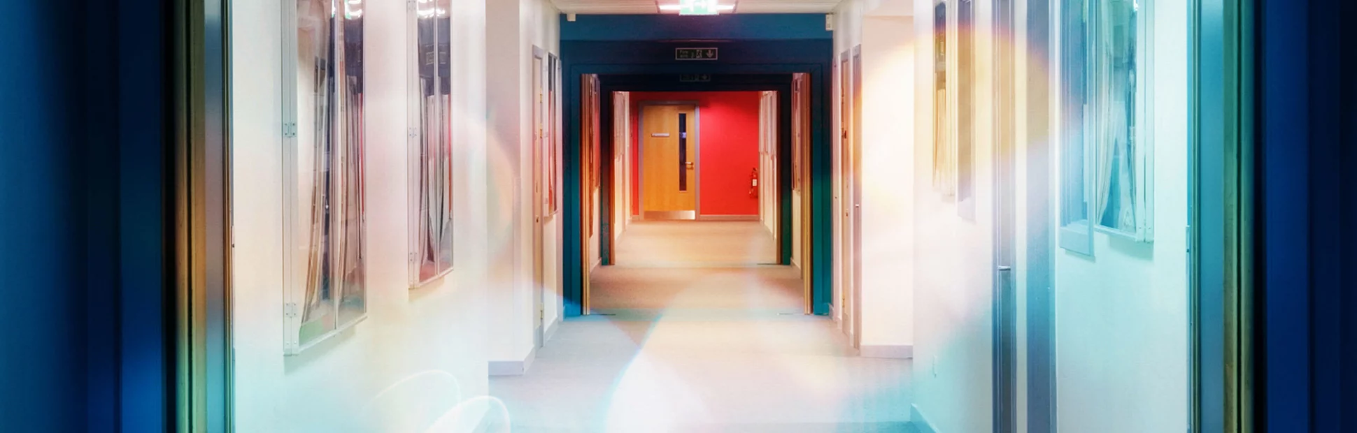 Looking along a corridor towards an exit door.