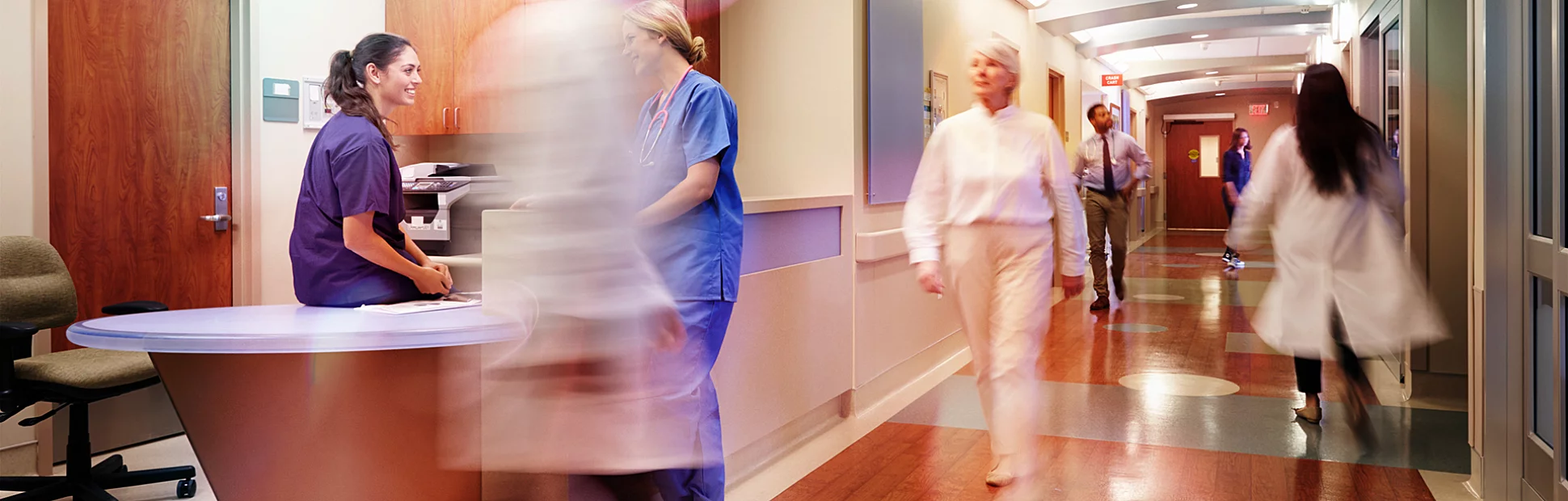 Busy Nurse's Station In Modern Hospital