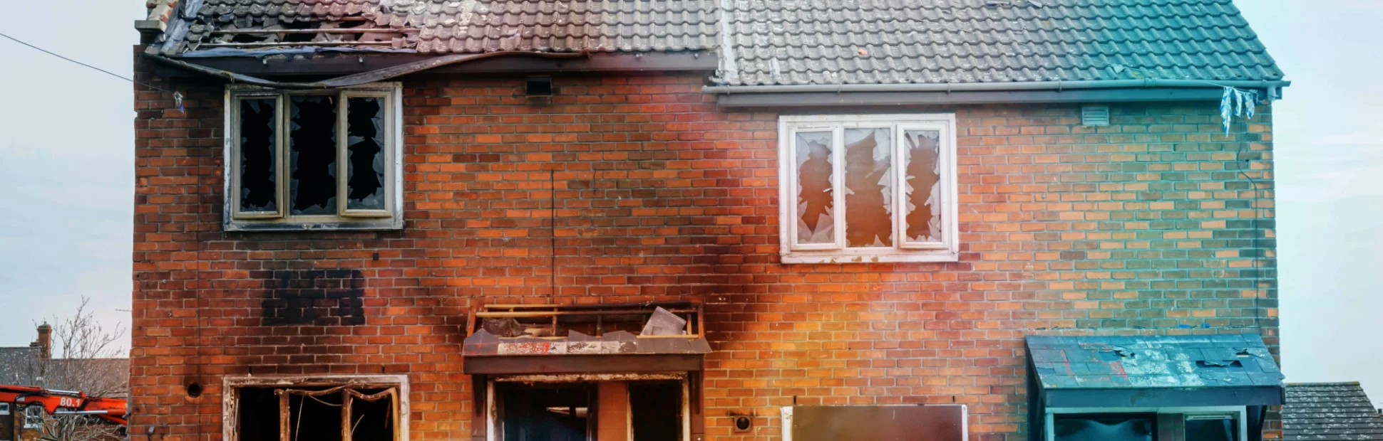 Burned out, derelict brick house after a fire