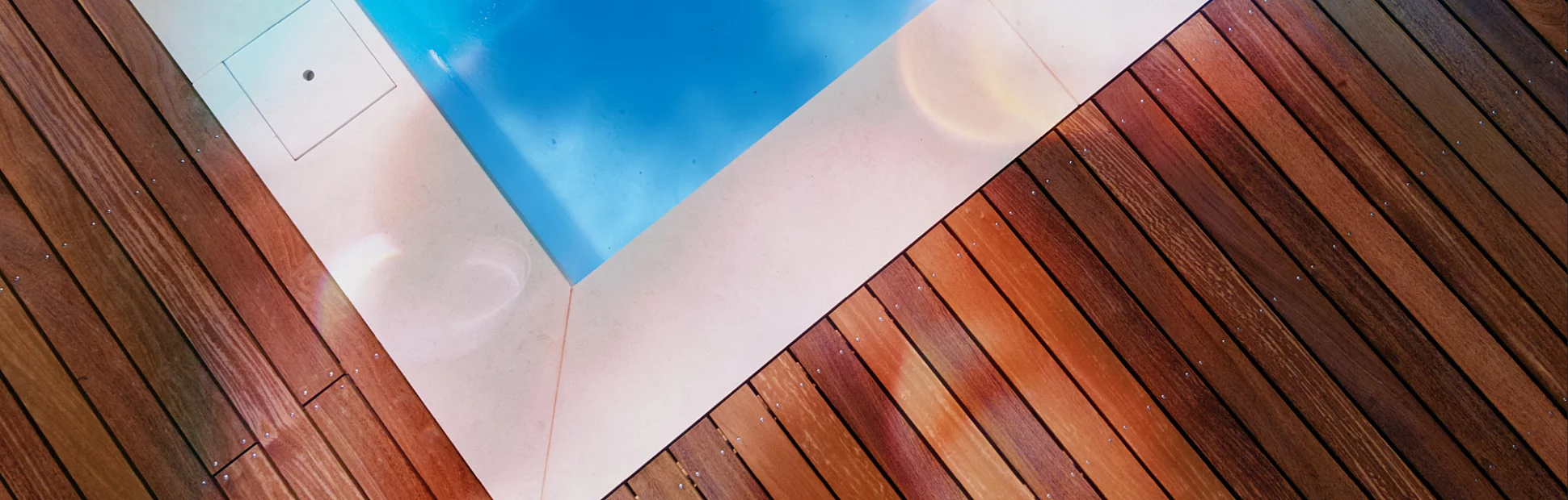 Drone flight over pool with beautiful wooden terrace