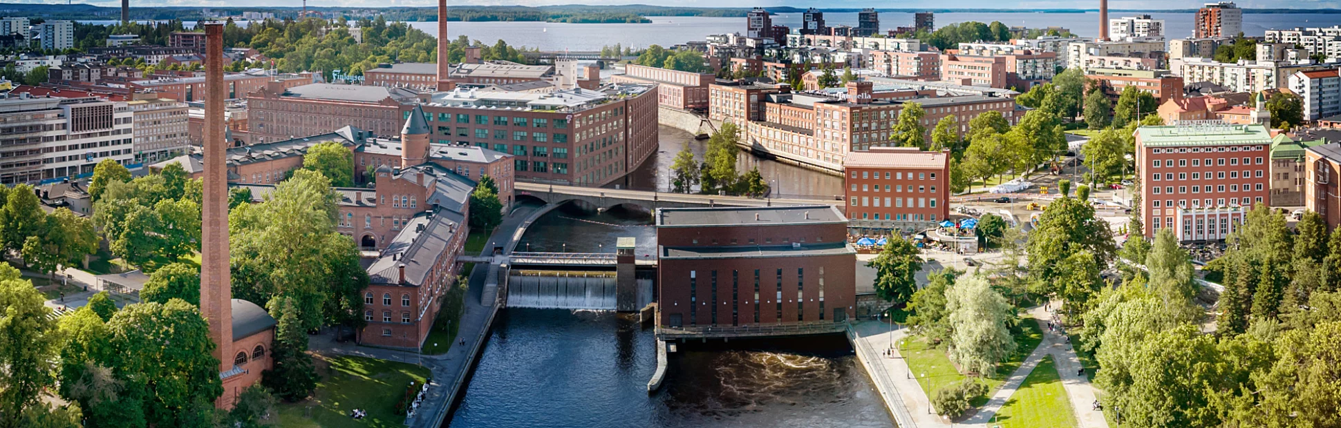 Tampere Cityscape Aerial Panorama in summer under blue sky with fluffy cloudscape