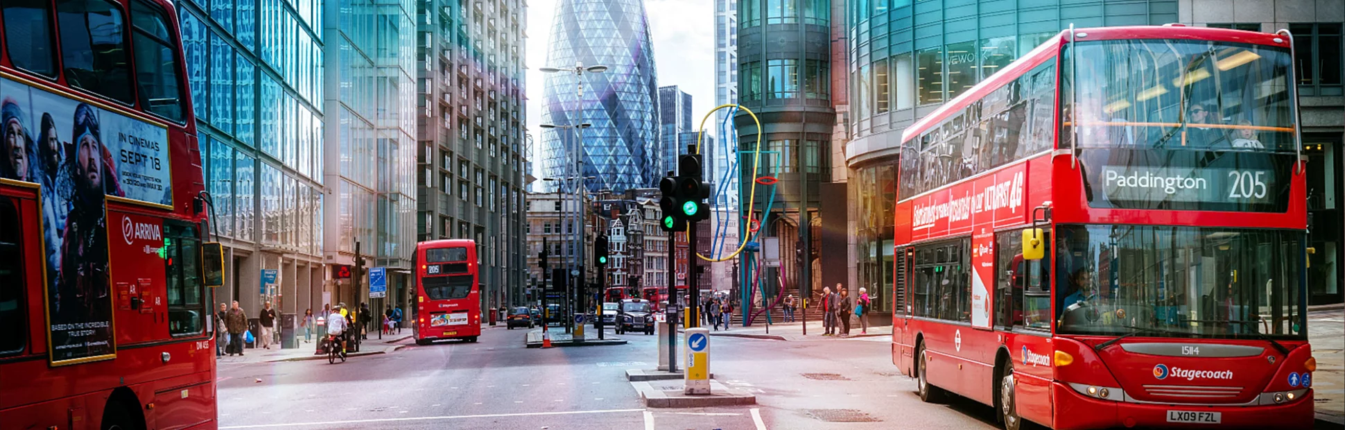 View of Street with Red Double Decker Buses, Gherkin skyscraper in the background.