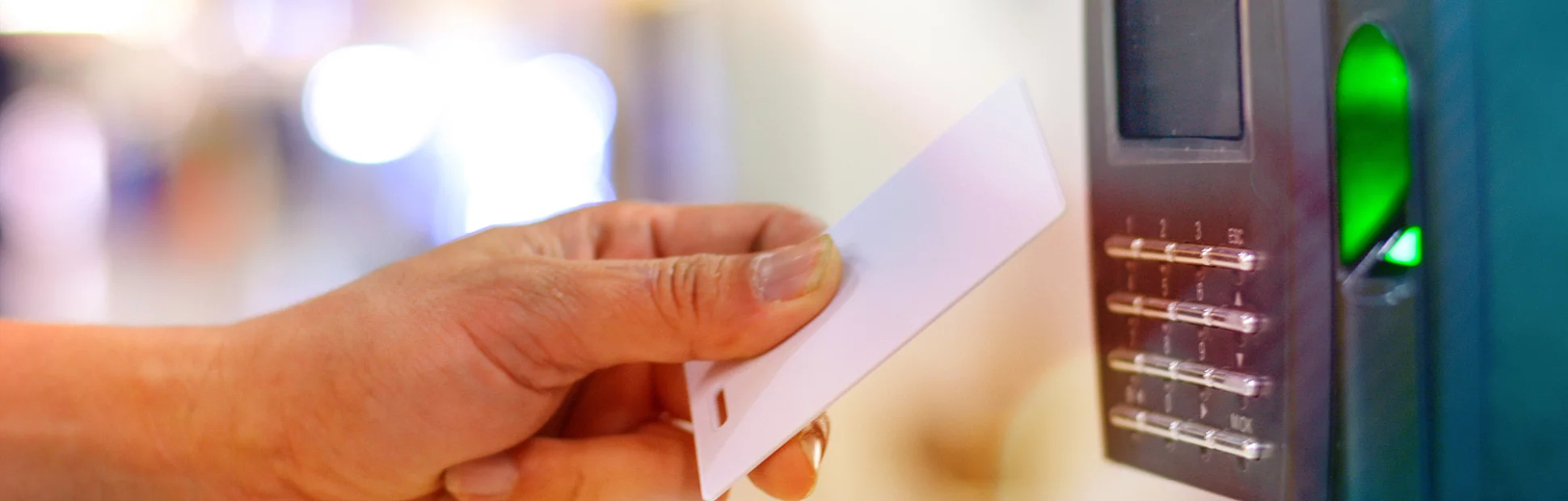 Hand on use key card to scan for unlock door security system, record office working time