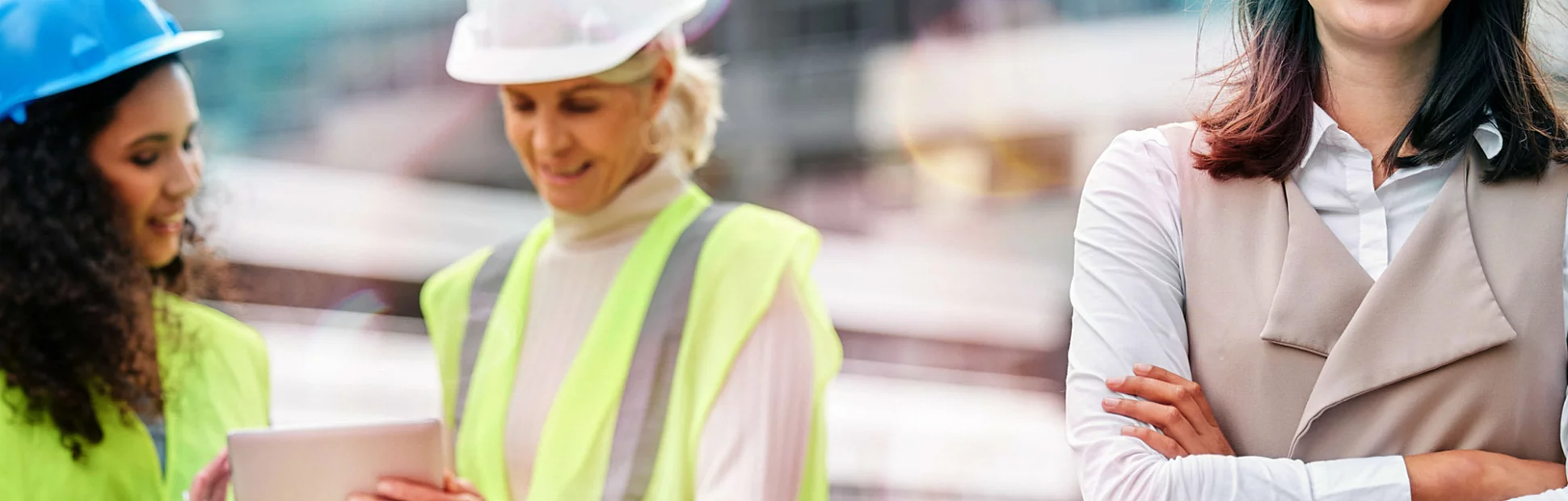 Cropped portrait of a young female engineer with her colleagues on a construction site