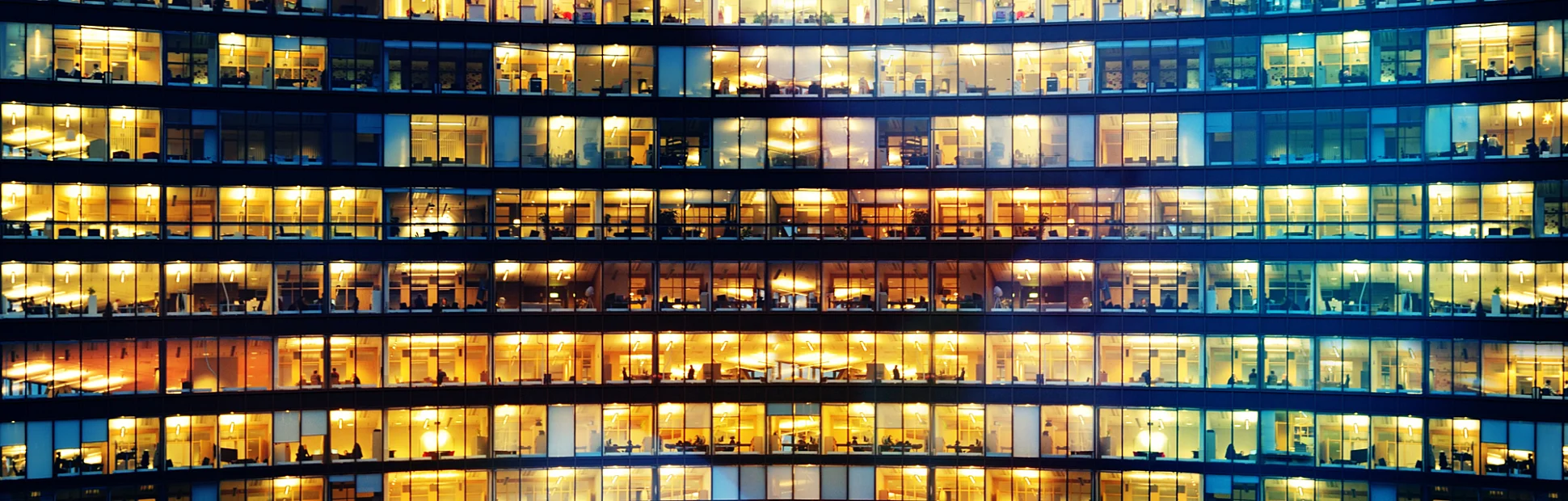 Office workers working late in major office building
