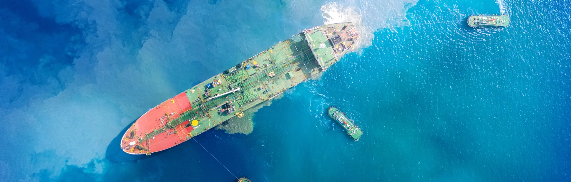 Top view Ship tanker oil Aerial view Liquefied Petroleum tanker approaching port with tugboats