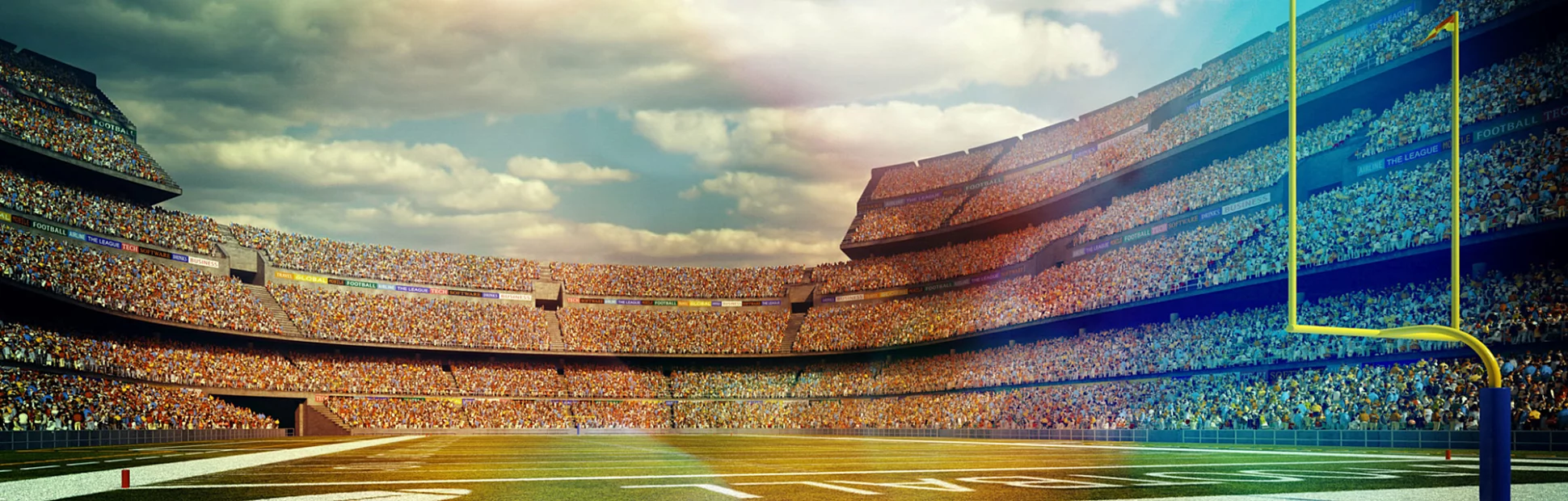 A panoramic image of a outdoor American football stadium full of spectators under blue sky.