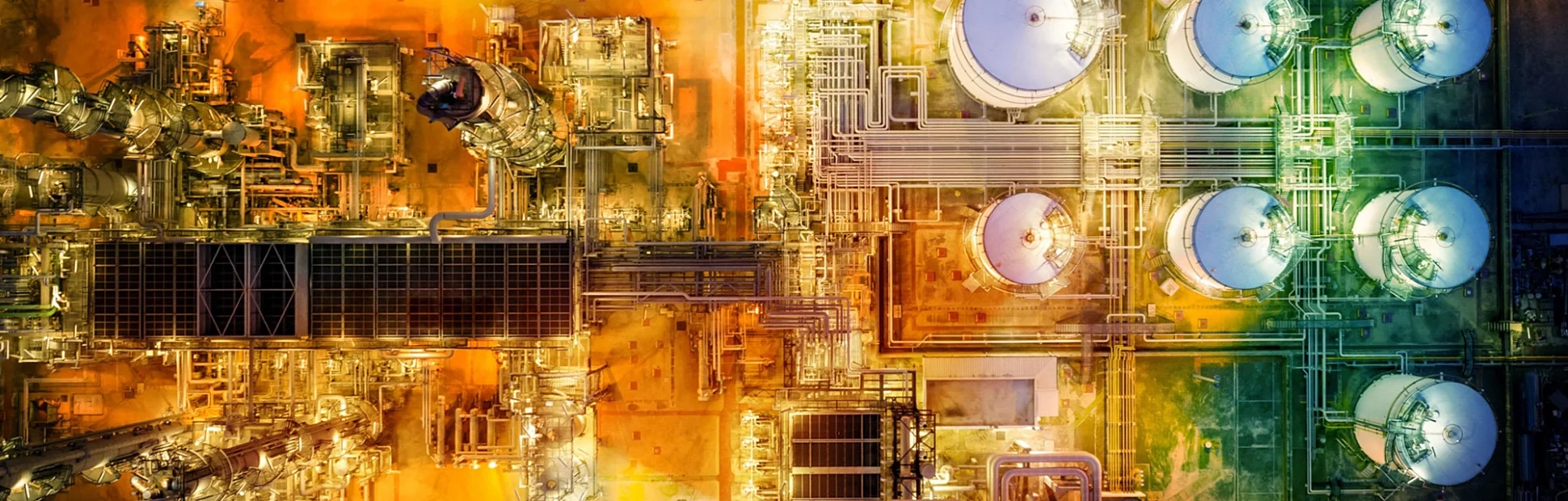 Oil refinery with storage tanks steel pipeline area at twilight aerial view from drone