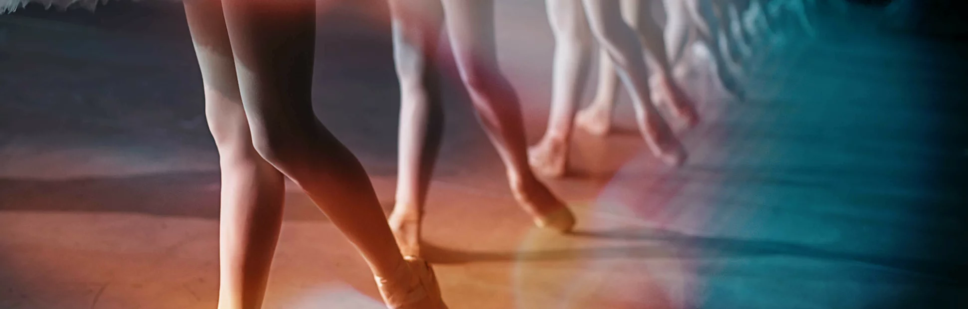 Dancers in white tutu synchronized dancing