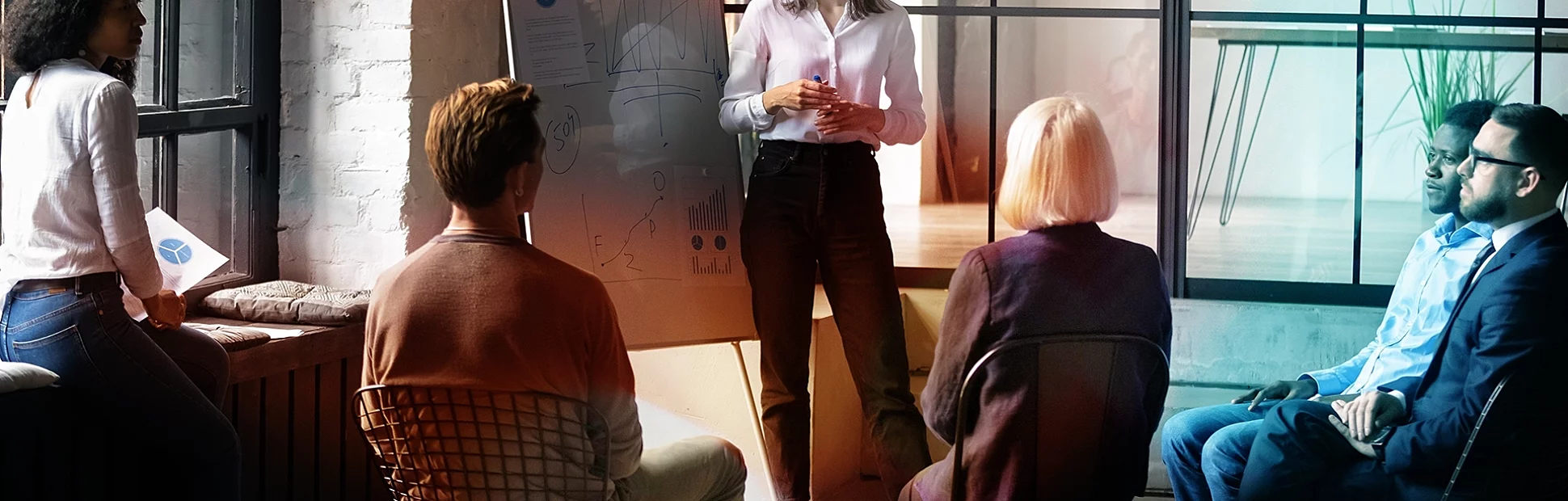 Confident lady business trainer coach leader give flip chart presentation consulting clients 