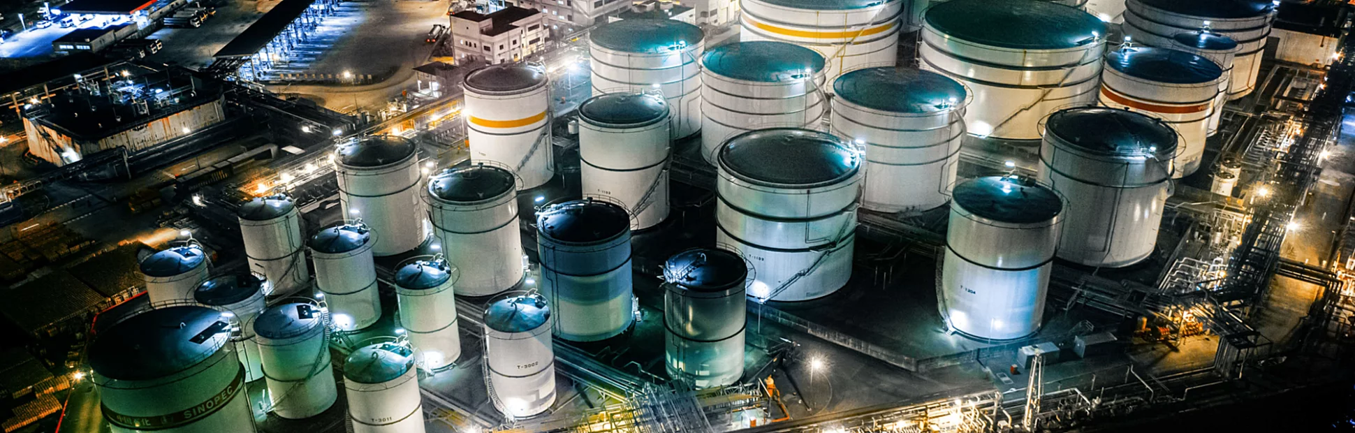Storage tank of liquid chemical and petrochemical product tank, Aerial view at night.
