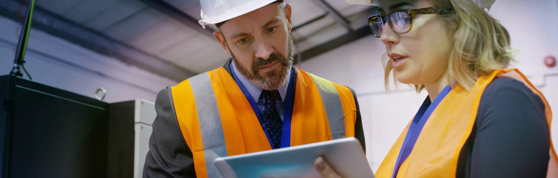 Shot of two engineers using a digital tablet together in an industrial place of work