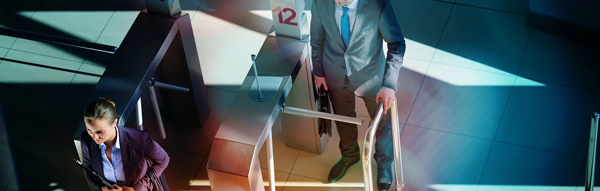 business people passing turnstile on the way to work