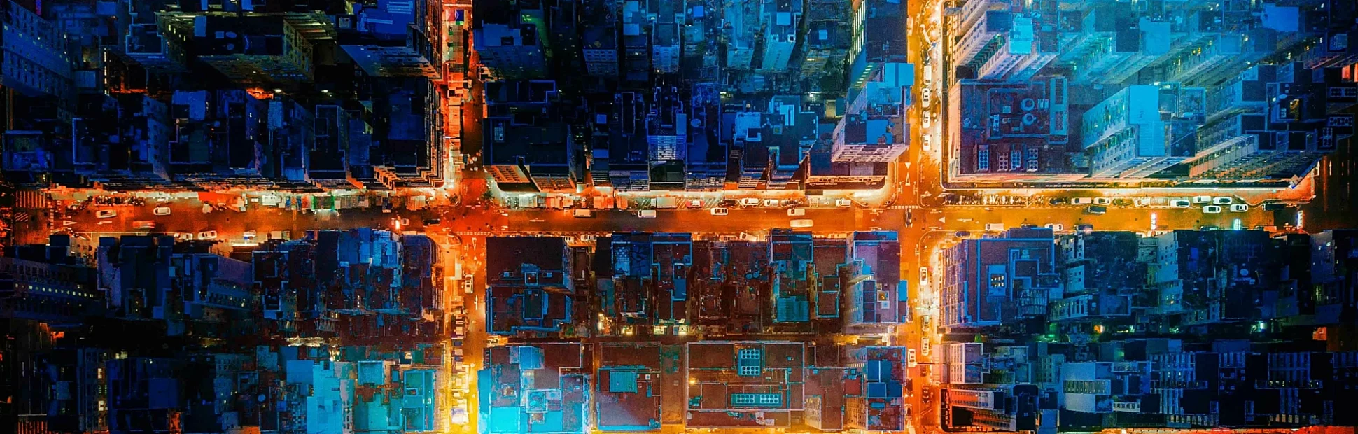 Financial district and business centers in smart city, technology. Top view of buildings at night.