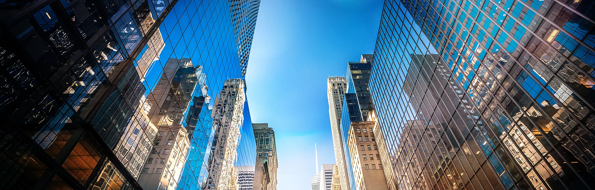 Futuristic skyscrapers in Midtown Manhattan on a sunny day.