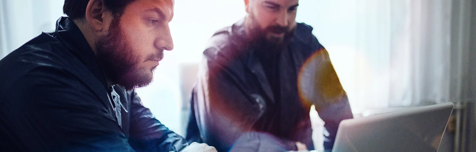 BI and CSI agents working in the office on a crime. they are working on laptop