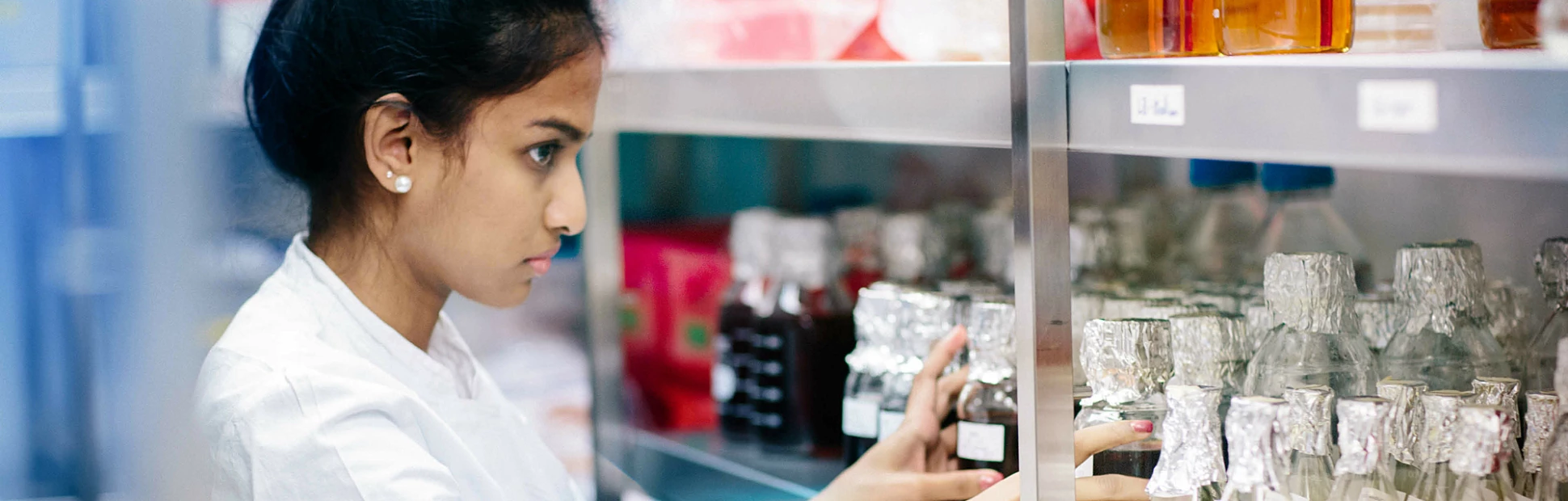 Young woman standing in a cold storage room from laboratory