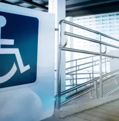accessibility ramp with large sign
