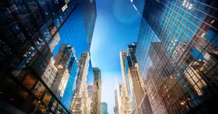 Futuristic skyscrapers in Midtown Manhattan on a sunny day.