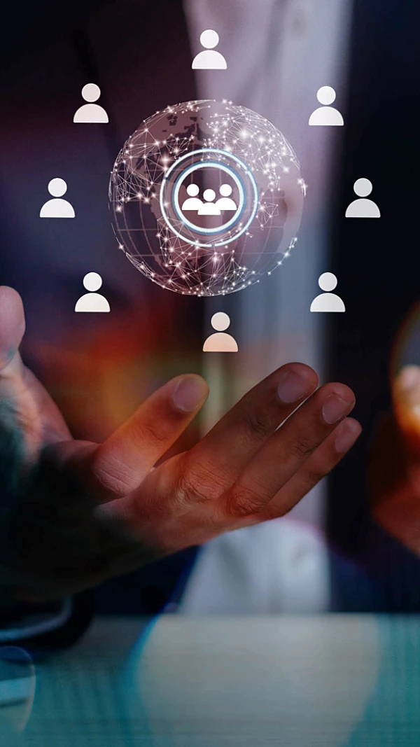 Businessman holding a cellphone with AI and a hologram of people