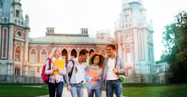 Young smiling students on campus