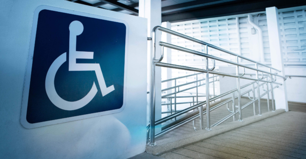 accessibility ramp with large sign