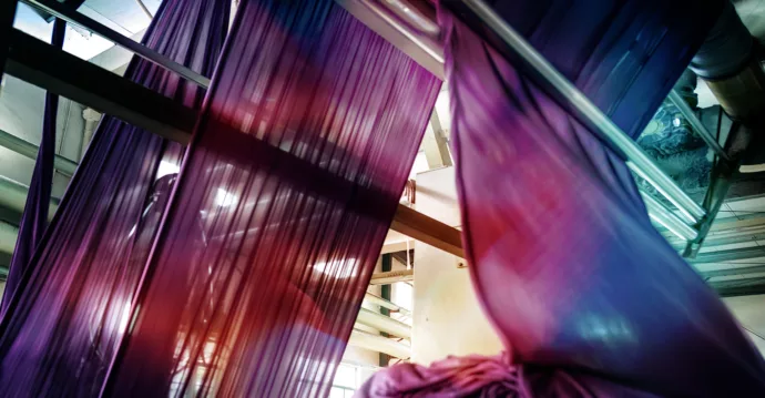 Fabric being processed at a textile plant.