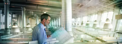 Architect viewing blueprints