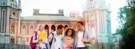 Young smiling students on campus