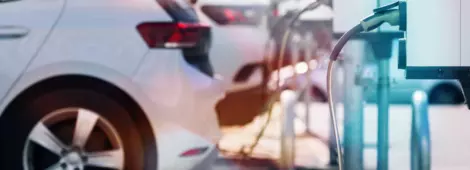 A parking lot with charging stations for electric cars.