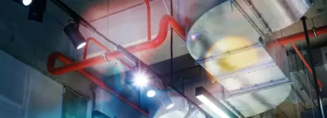 Industrial utilities under the ceiling. Ventilation, air conditioning, lighting and fire fighting