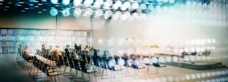 Abstract group of business people in the convention center.