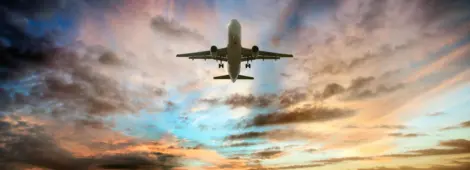 Passenger airplane taking of at sunrise