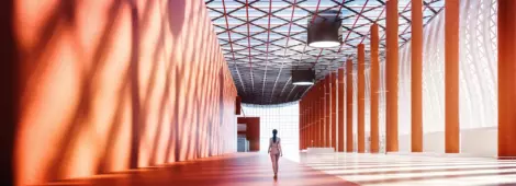 Lone businesswoman walking in empty exhibition hall