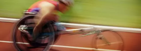Wheelchair racer on track, side view