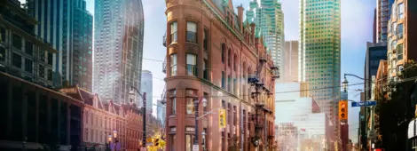 Building in downtown Toronto with CN Tower on background - Toronto, Ontario, Canada