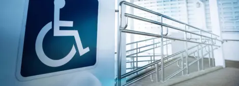 accessibility ramp with large sign