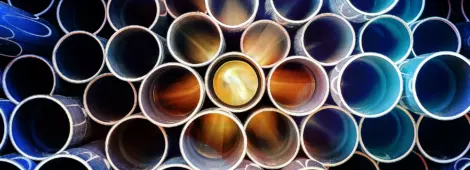 abstract pattern of aged pvc pipe with sun lights