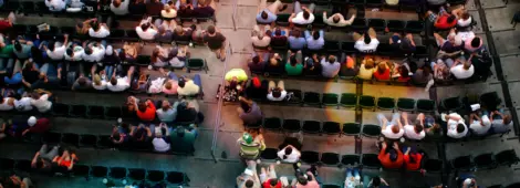 Shot from above a crowd watching a baseball game.