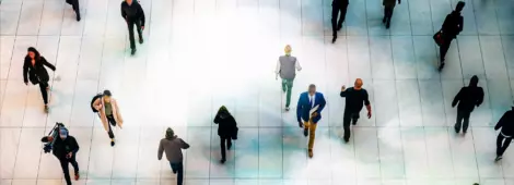 Top view people walking white floor or large crowd of anonymous people.