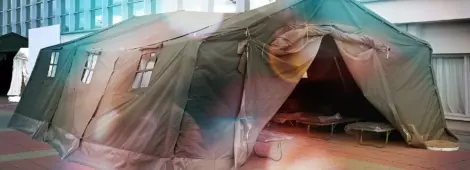 Large heavy duty tent set up in a large indoor space