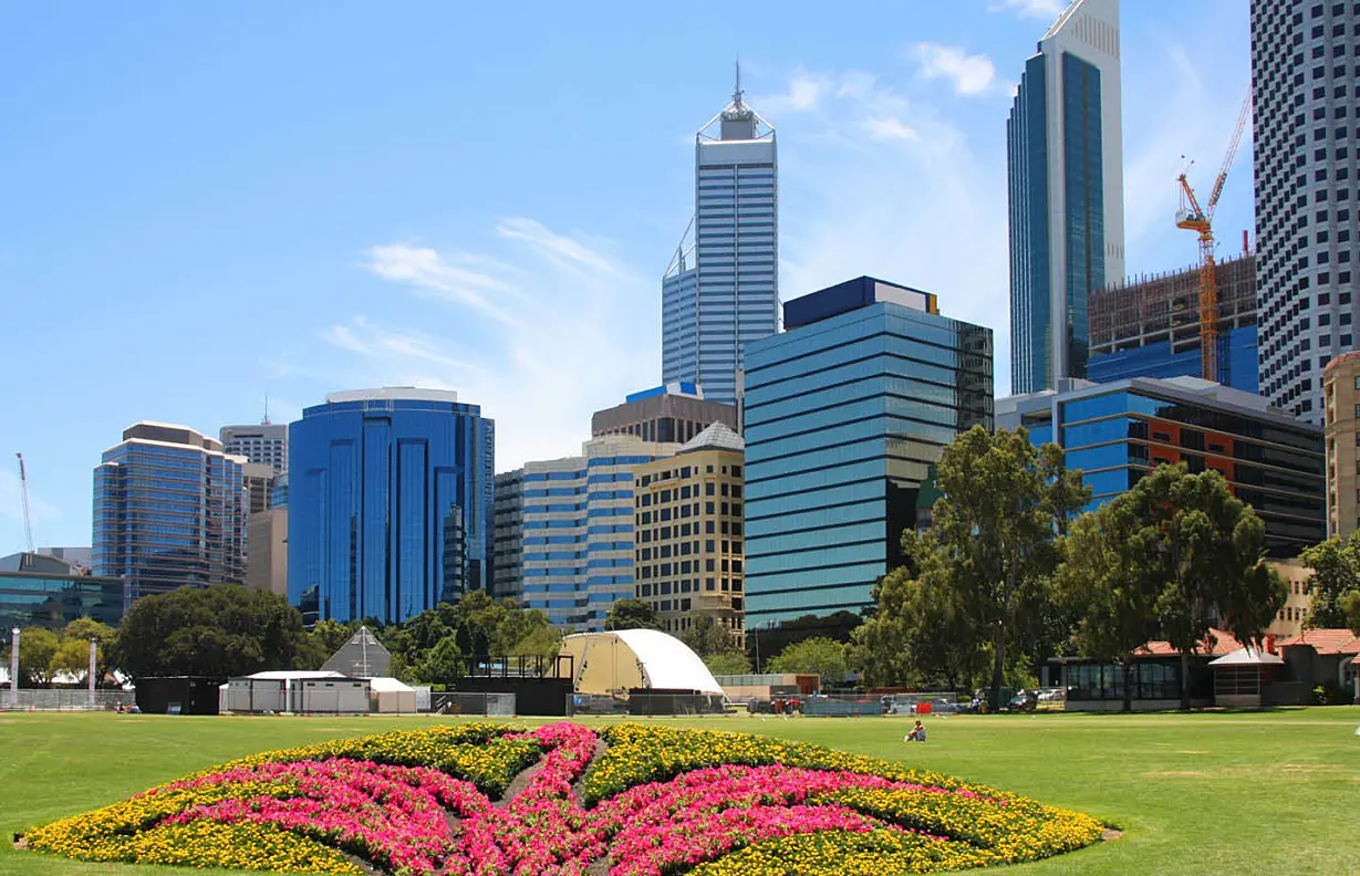 Perth skyline behind a park on a sunny day