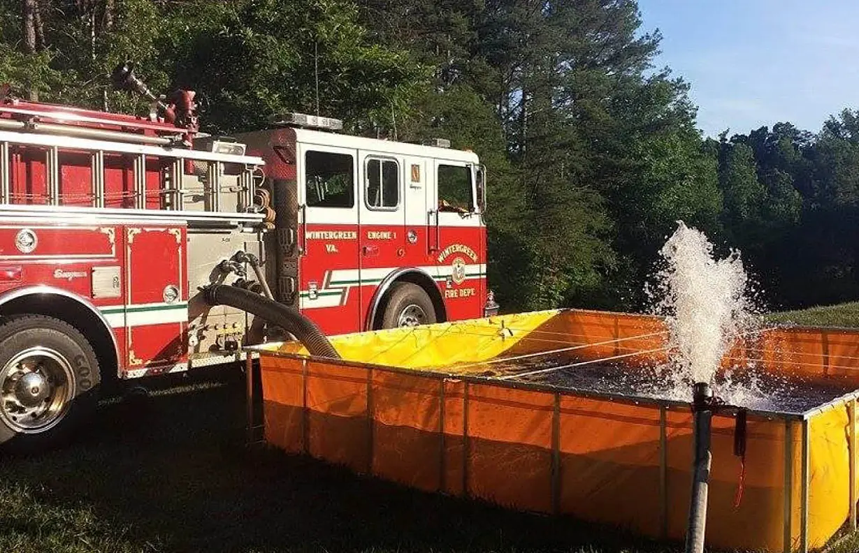 Red Fire Truck and Yellow Portable Dump Tank