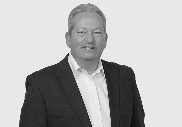 A headshot image of Paul McManus