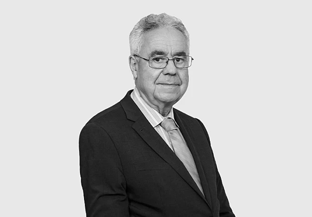 A headshot image of Carlos Quaglia