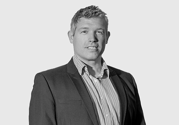 A headshot image of Will Hutchinson