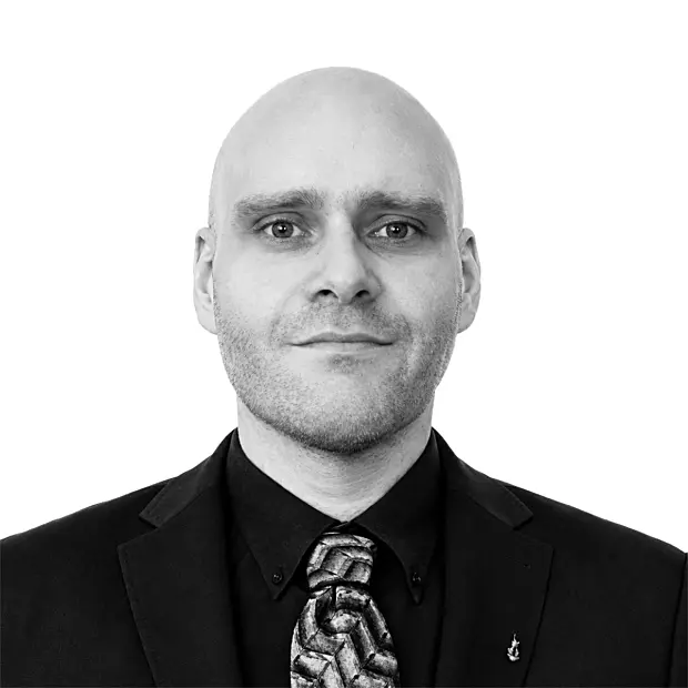 A headshot image of Amir Baroughi