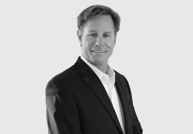 A headshot image of Gregory Desmond